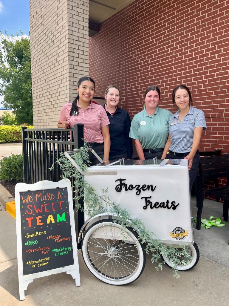 Team serving happy customers