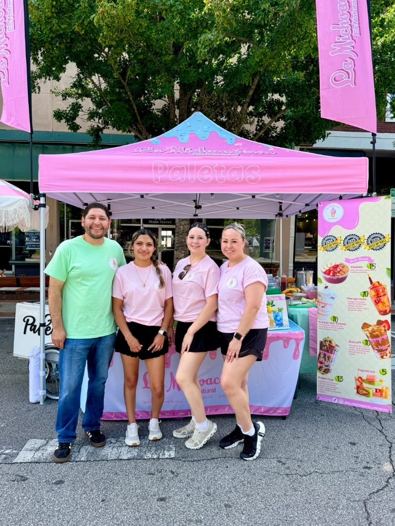 Full team at the Paletas tent on Main Street Gainesville