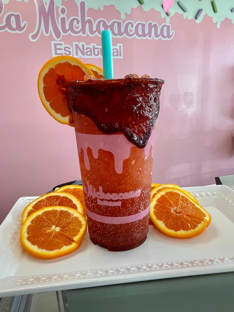Fresh agua de tamarindo with orange slices