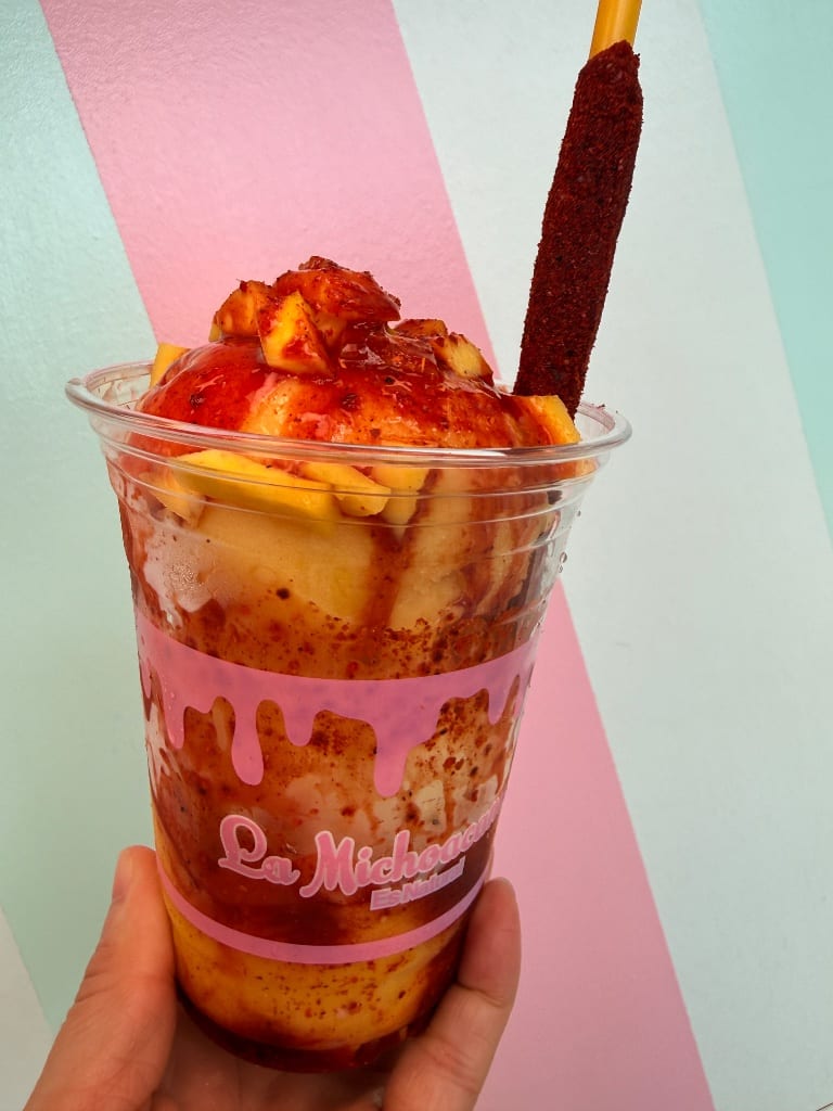 Mango chamoy fruit cup with tamarind straw
