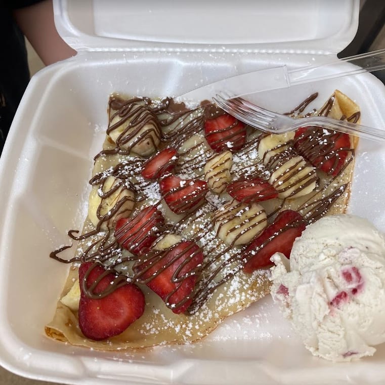 Specialty ice cream crepe with toppings